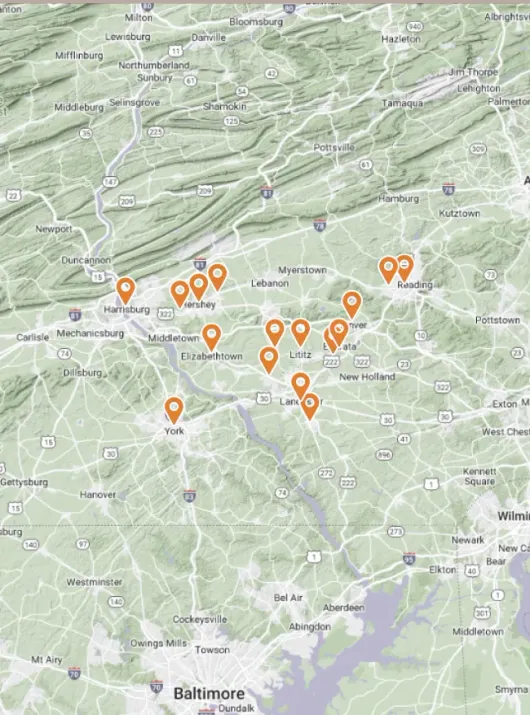 A map of baltimore and the surrounding area with orange markers on it.